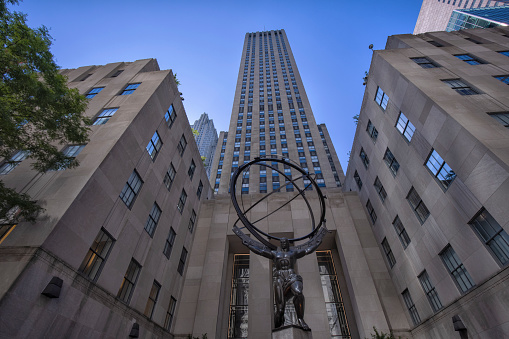 Low angle view of the Atlas Statue in front of the Rockefeller Center in midtown Manhattan New York City.