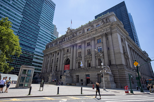 Sydney,NSW,Australia-November 18,2016: Side view of Sydney Town Hall with people, courtyard and clock tower in downtown Sydney, Australia.