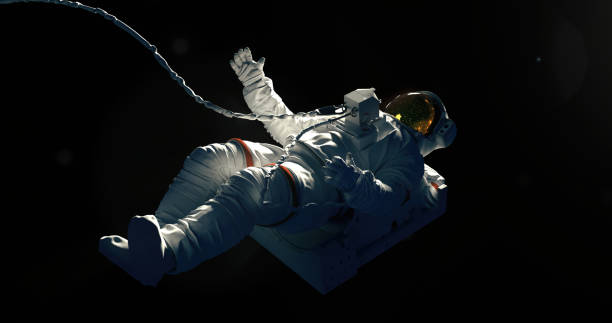 Spaceman on a black background hovering in an outer space stock photo