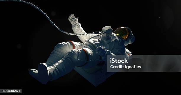 Spaceman On A Black Background Hovering In An Outer Space Stock Photo - Download Image Now