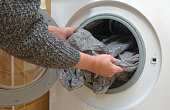 Woman unnloading washing machine