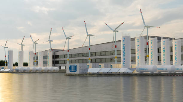 Hydrogen Storage Compartment, Wind Turbines, Solar Panels And Li-ion Battery Container On Seacoast. Energy Storage System stock photo