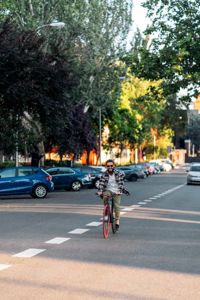 istock Happy Man Riding his Bike 1434610078