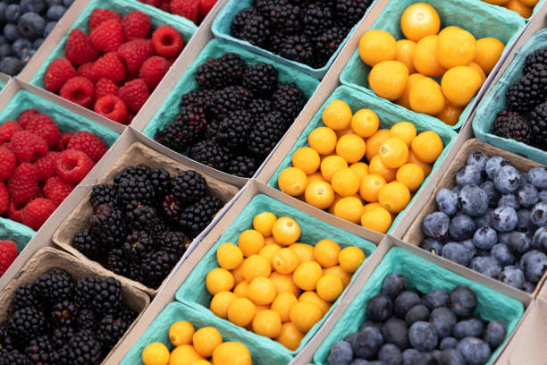 various berries in boxes - market fruit strawberry farmers market imagens e fotografias de stock