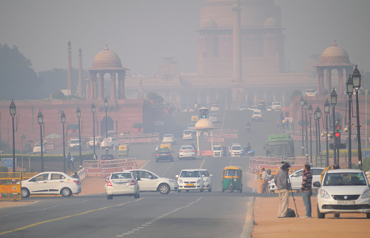Delhi, India - November 21, 2017: Heavy traffic on the streets of New Delhi  in New Delhi covered in heavy smog.