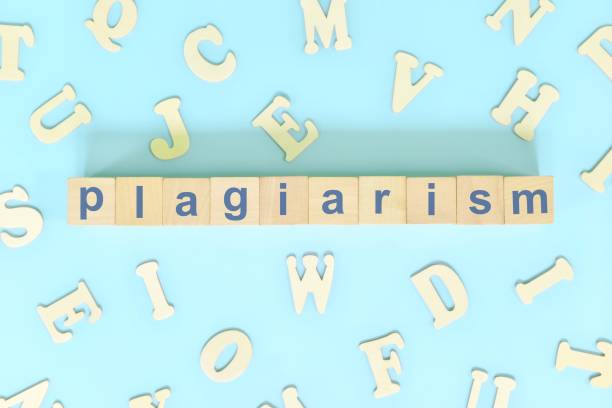 istock Plagiarism concept. Word typography on wooden blocks creative flat lay composition in blue background. 1434611574