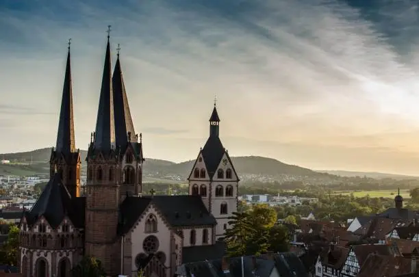 An aerial shot of Romanesque Church of St. Mary at sunset in Gelnhausen, Germany