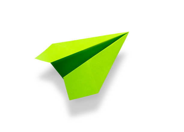 istock Green paper plane origami isolated on a white background 1434613395