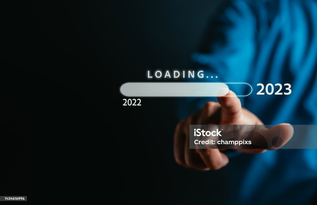 Businessman touching to virtual download bar and loading for New Year and changing year 2022 to 2023. start up planing business in next years concept. 2023 Stock Photo