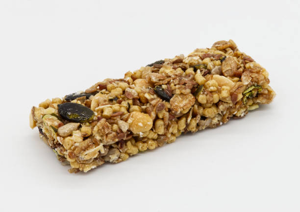 istock Protein bar with whole grains peanuts and cranberries isolated on white background. 1434617205