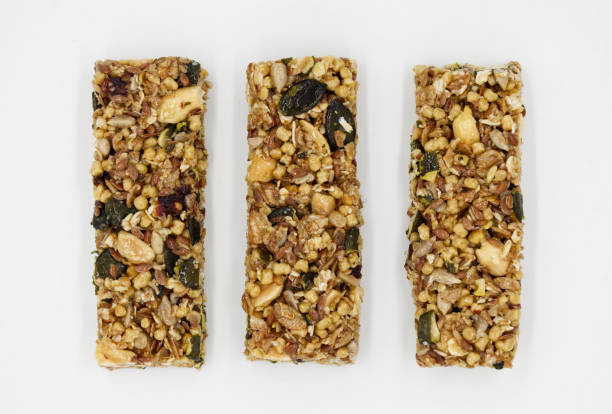 istock Protein bar with whole grains peanuts and cranberries isolated on white background. 1434617208