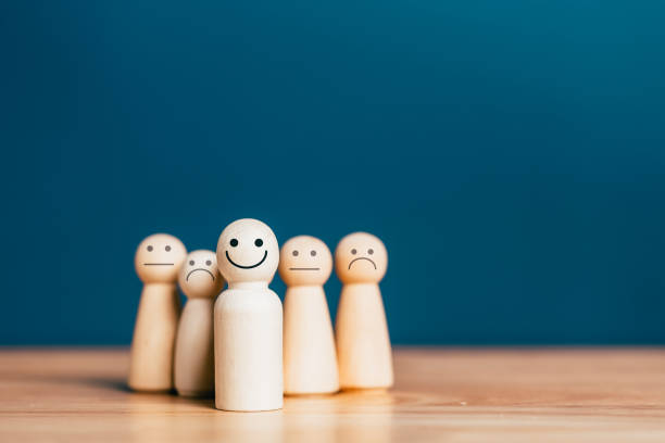 istock Quality assurance, Guarantee, Standards, ISO certification. excellent business services rating customer experience. Satisfaction survey. Smiley of Human wooden block concept. 1434617273