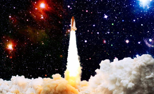 istock Shuttle launch in the clouds to outer space. Dark space with stars on background.Spaceship flight. Elements of this image furnished by NASA 1434618318