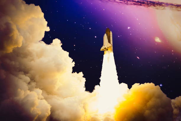 istock Shuttle launch in the clouds to outer space. Dark space with stars on background.Spaceship flight. Elements of this image furnished by NASA 1434618440
