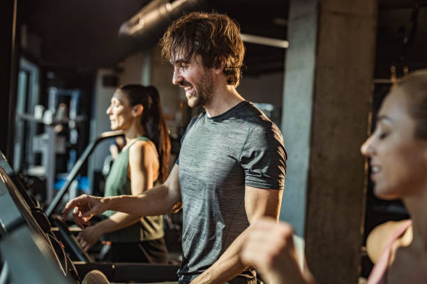 istock Adjusting speed on treadmill in a gym! 1434619938