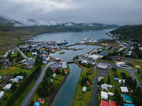Beautiful aerial view of the town of Seydisfjordur and its Blue church and rainbow street, pier and cruise ships