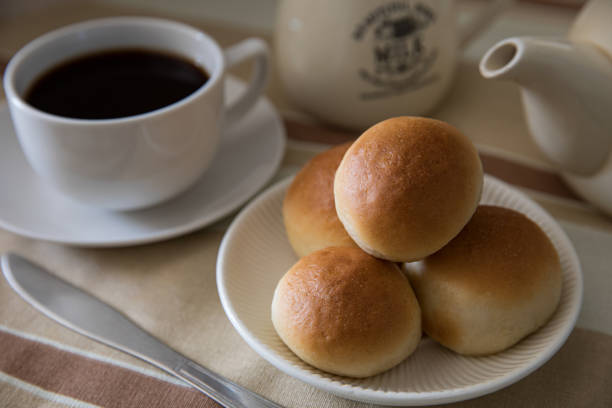 English milk buns served with beverage.