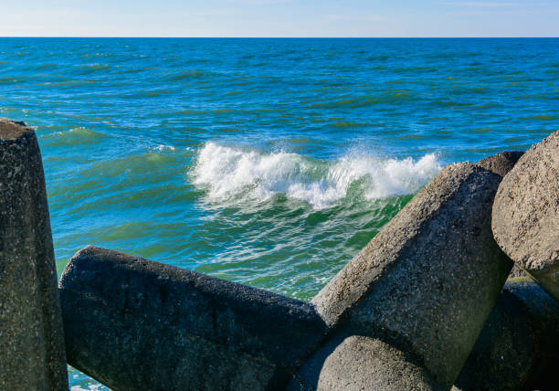 wave breaker along the sea shore. Sand beach.