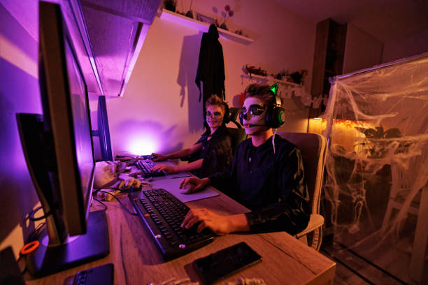istock Teenagers playing video game on Halloween 1434630631