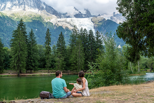 Family having the afternoon at Gaillands lake in Chamonix, french alps.