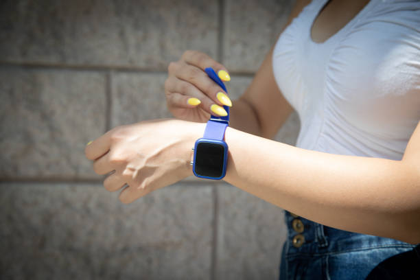 istock Woman wearing blue smart watch. 1434635935