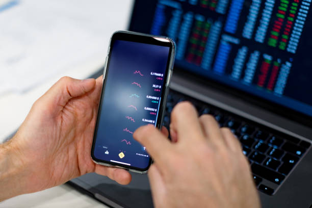 istock Closeup of hands with mobile screen with cryptocurrencies 1434638517