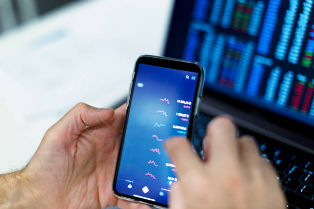 istock Closeup of hands with mobile screen with cryptocurrencies 1434638528