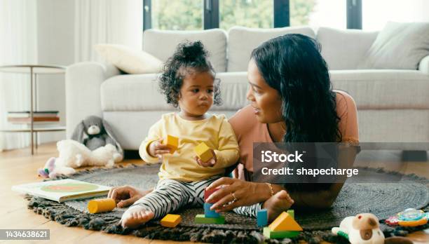 Learning Building And Mother And Baby On A Carpet Playing Relax And Bonding On A Floor Together Family Child Development And Girl Enjoy Fun Game With Color Blocks And Happy Parent In Living Room Stock Photo - Download Image Now