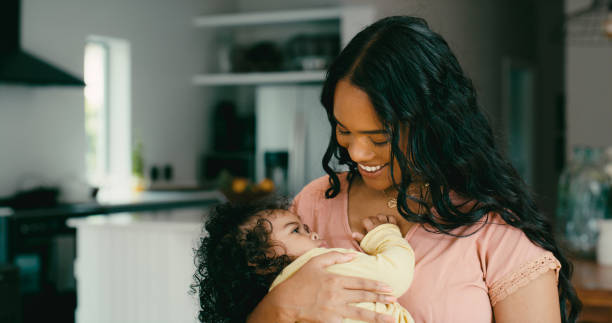 istock Love, mom and baby affection bonding together maternal care development. Happiness, infant wellness and affection, smile, new single parent and happy mama holding adorable child against chest at home 1434638671