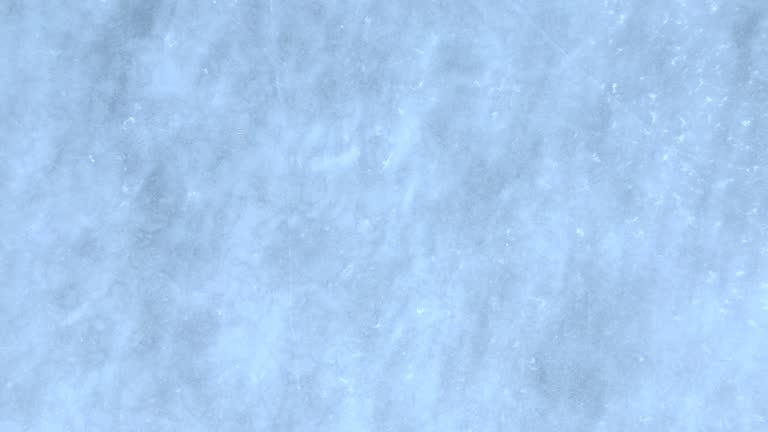 Blue cracked ice close-up, natural background, aerial view.