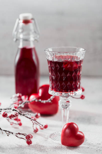 istock Red cocktail, vodka or liqueur and Heart shape decorations 1434648524
