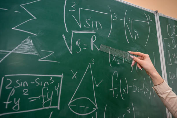 istock female hand with chalk and write math formula on blackboard 1434648851