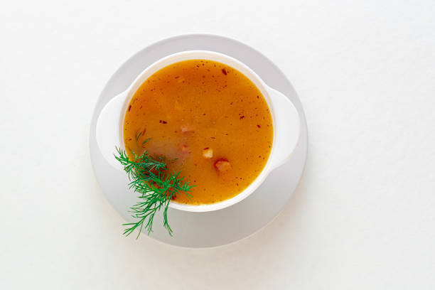 istock Pea soup with bacon and dill in a bowl on a white isolated background. Selective focus 1434649550