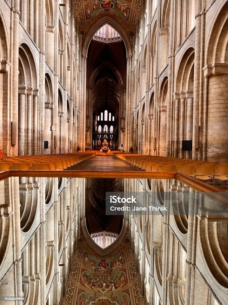 Reflections of Ely Cathedral’s roof from a mirror set on a table. Ely Cathedral’s roof view reflecting from a mirror. Ely - England Stock Photo