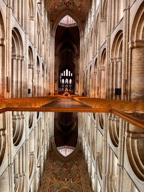 Reflections of Ely Cathedral’s roof from a mirror set on a table. Ely Cathedral’s roof view reflecting from a mirror. ely england photos stock pictures, royalty-free photos & images