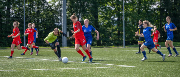 istock Female players kicking ball 1434650480