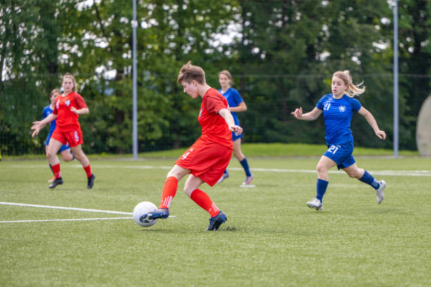 istock Female players kicking ball 1434650483