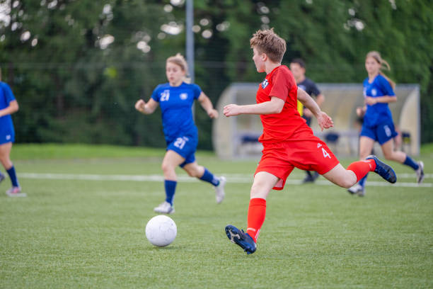 istock Female player kicking ball 1434650499