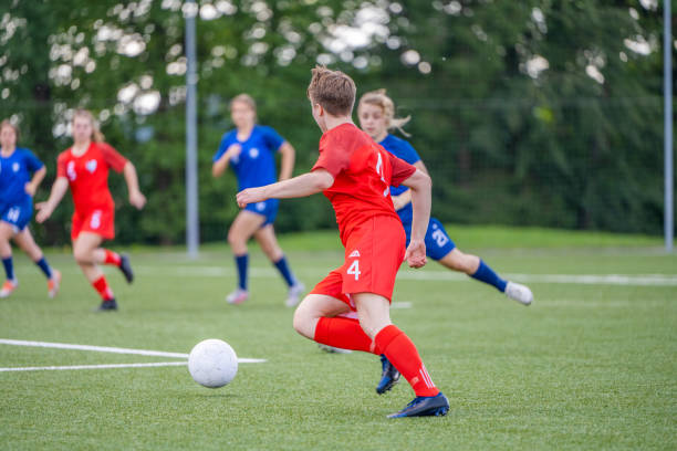 istock Female player kicking ball 1434650504