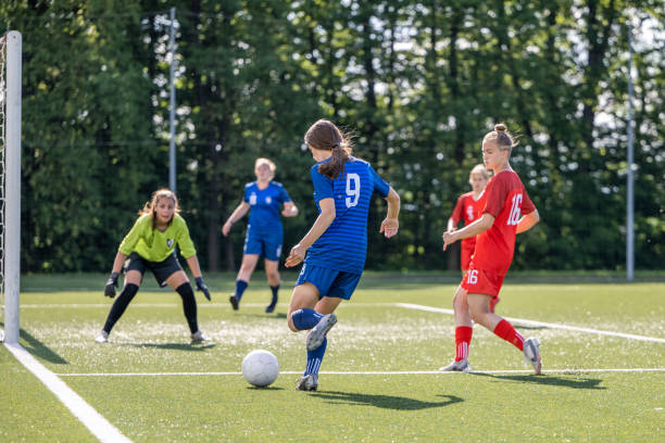 istock Football player kicking ball at goal 1434650507