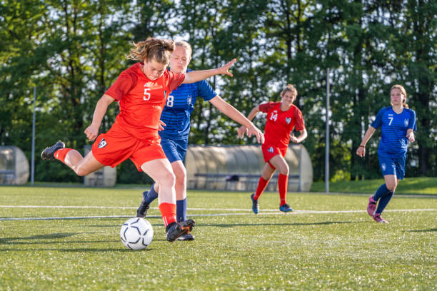 istock Female player kicking ball 1434650519