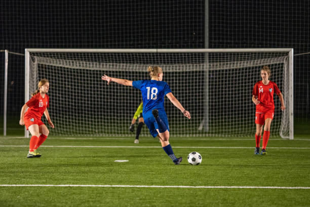 istock Football player attempting to kick goal 1434650547