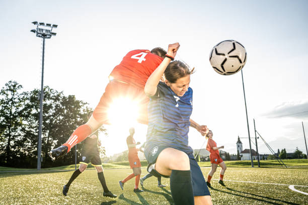 istock Female players heading ball 1434650569