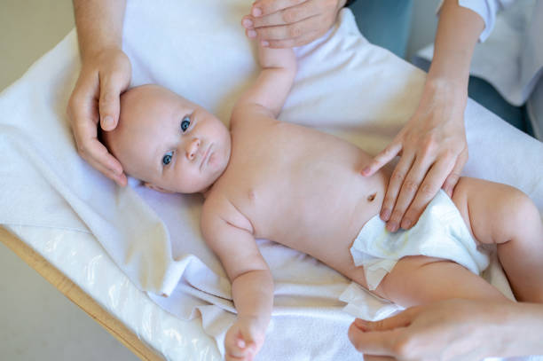 istock Mom changing a diaper to a baby 1434650914