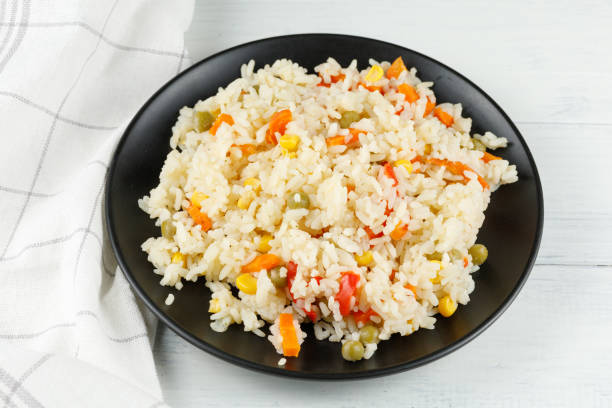 istock Rice with vegetables in a plate on the table. 1434652400