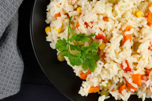 istock Rice with vegetables in a plate on the table. 1434652459