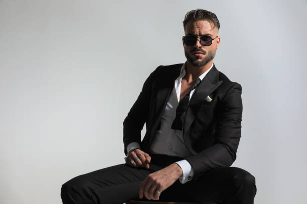 istock arrogant elegant groom wearing black tuxedo with open collar shirt 1434652463
