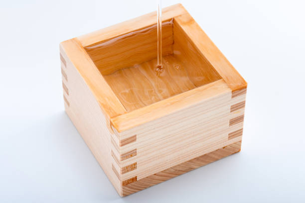 istock Pour Japanese sake into a masu 1434655953