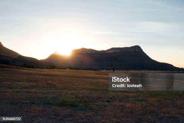 Sunset Sunbeams Sunburst As They Hit The Mountain Edge Stock Photo - Download Image Now