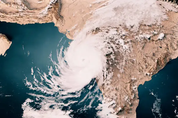 3D Render of a Topographic Map of the Arabian Sea with the clouds from May 17, 2021. 
Cyclone Tauktae approaching the west coast of India, Gujarat state.
All source data is in the public domain.
Cloud texture: Global Imagery Browse Services (GIBS) courtesy of NASA, VIIRS data courtesy of NOAA.
https://www.earthdata.nasa.gov/eosdis/science-system-description/eosdis-components/gibs
Color texture: Made with Natural Earth.
http://www.naturalearthdata.com/downloads/10m-raster-data/10m-cross-blend-hypso/
Relief texture: GMTED 2010 data courtesy of USGS. URL of source image:
https://topotools.cr.usgs.gov/gmted_viewer/viewer.htm
Water texture: SRTM Water Body SWDB: https://dds.cr.usgs.gov/srtm/version2_1/SWBD/